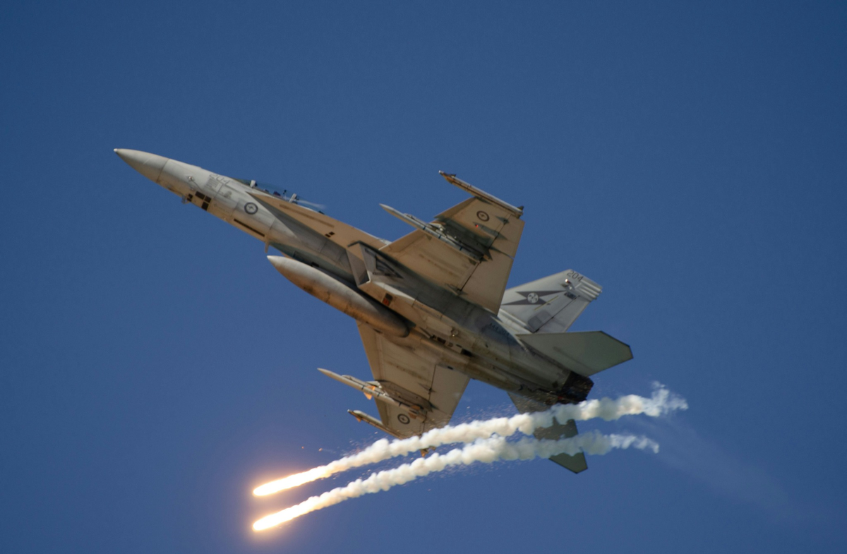 Fighter jet deploying a ballistic projectile